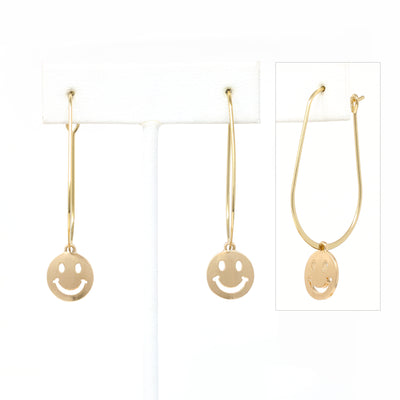A pair of smiley face charmed teardrop hoop earrings in gold.