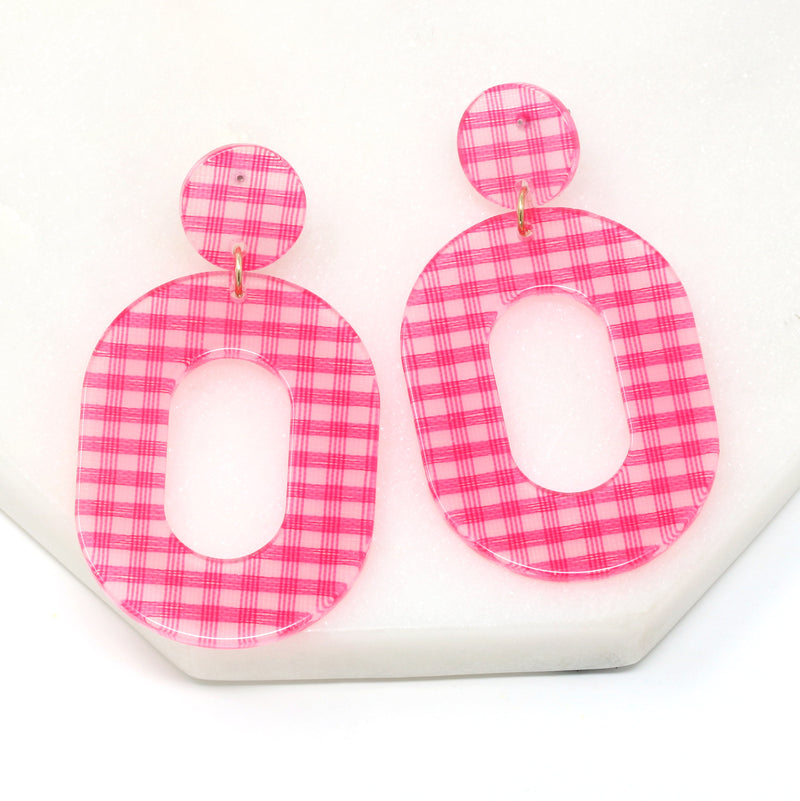 A pair of striped resin drop and dangle earrings in hot pink color.