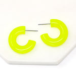 Featuring a pair of minimalist design bold resin hoop earrings crafted with high-quality neon yellow colored resin material, adding a pop of color to any outfit.