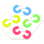 Featuring a pair of minimalist design bold resin hoop earrings crafted with high-quality neon colored resin material, adding a pop of color to any outfit.