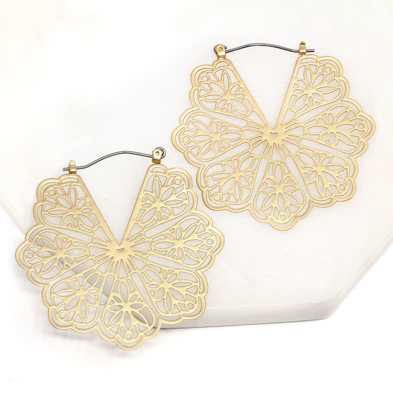 A pair of floral patterned filigree lightweight statement hoop earrings in gold.