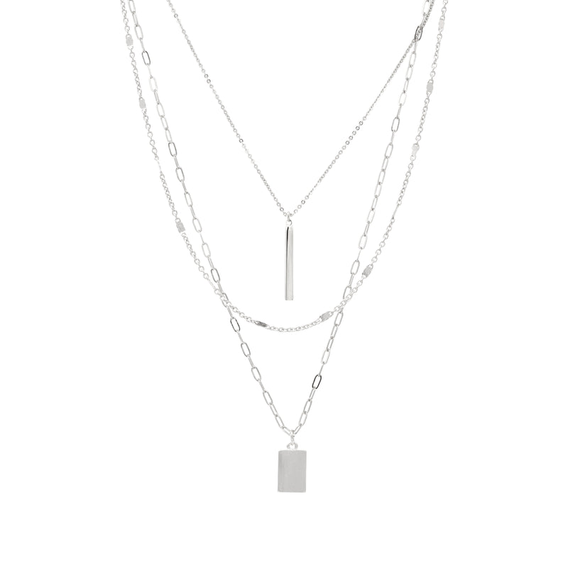 A modern triple-layered necklace in silver dangled with two bar charms.