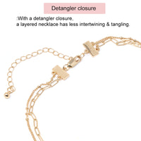 Double Layered Necklace with Star & Sunburst Charms