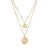 A modern two-layered necklace in gold dangled with two small charms.