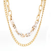 A set of double layered chain necklace mixed with ivory resin link chain.